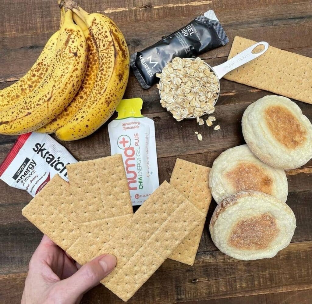 These are examples of carb sources for runners, including: bananas, sports gels, oatmeal, graham crackers, and English muffins. Fueling properly is one way for how to be a better runner.